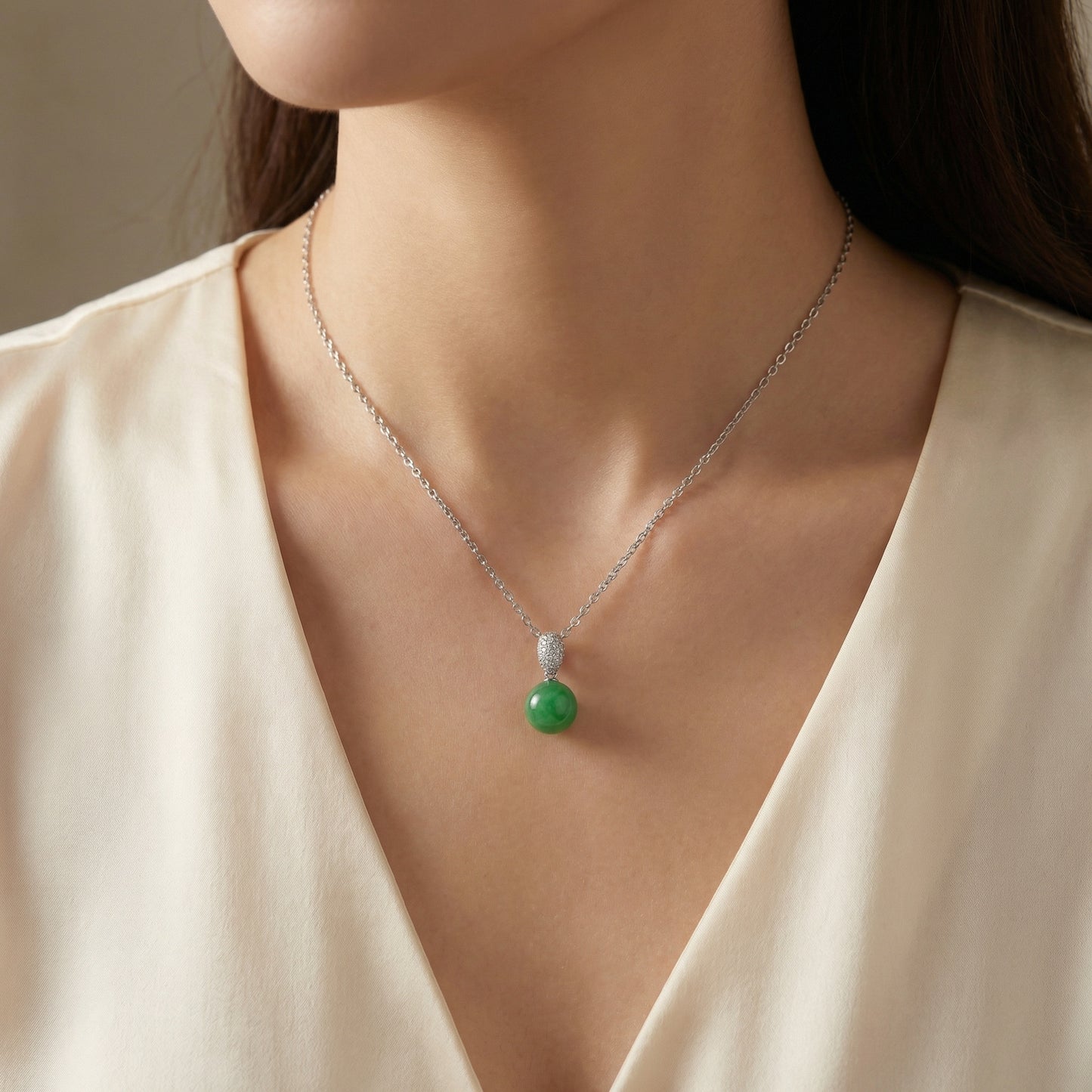Polished green jade sphere pendant