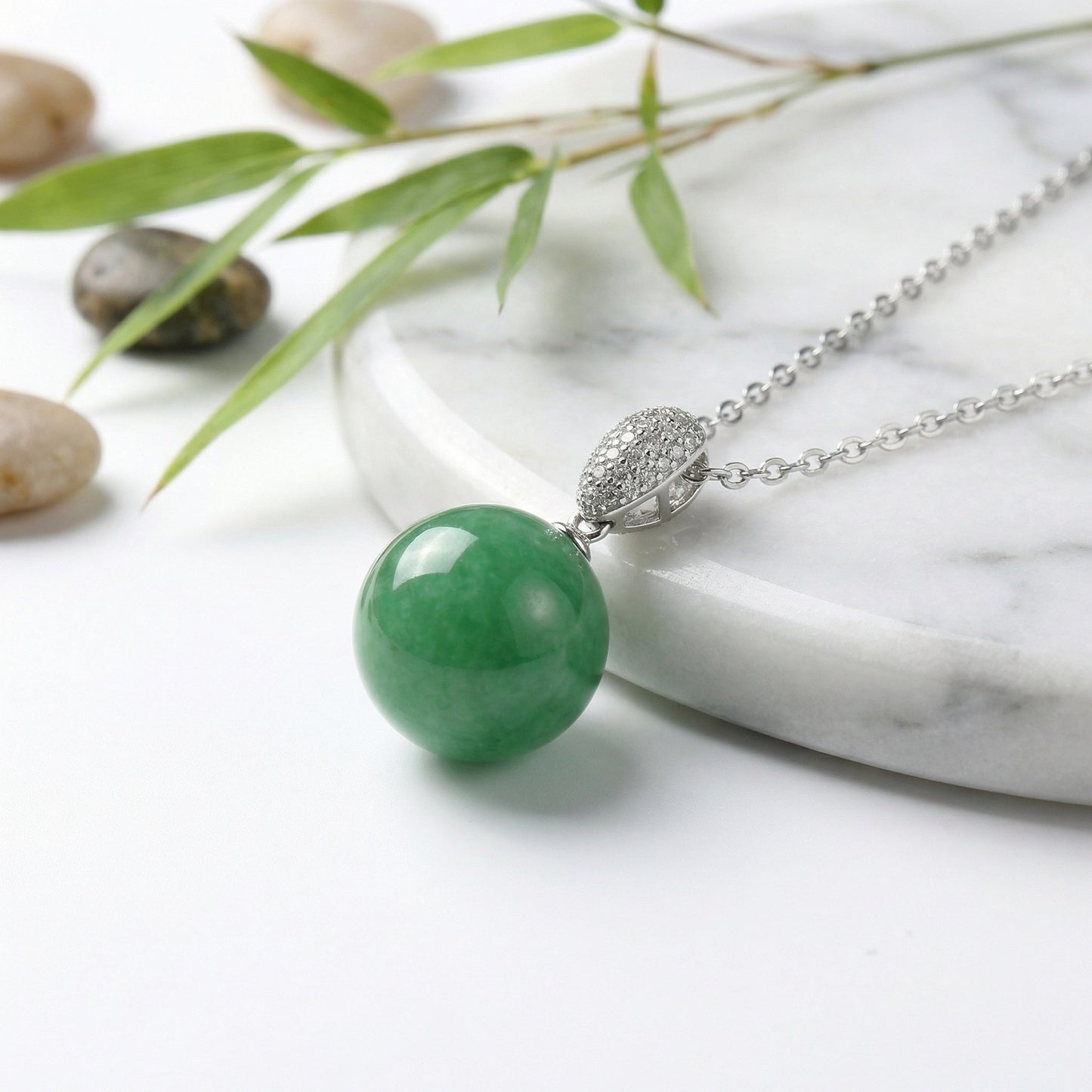 Polished green jade sphere pendant